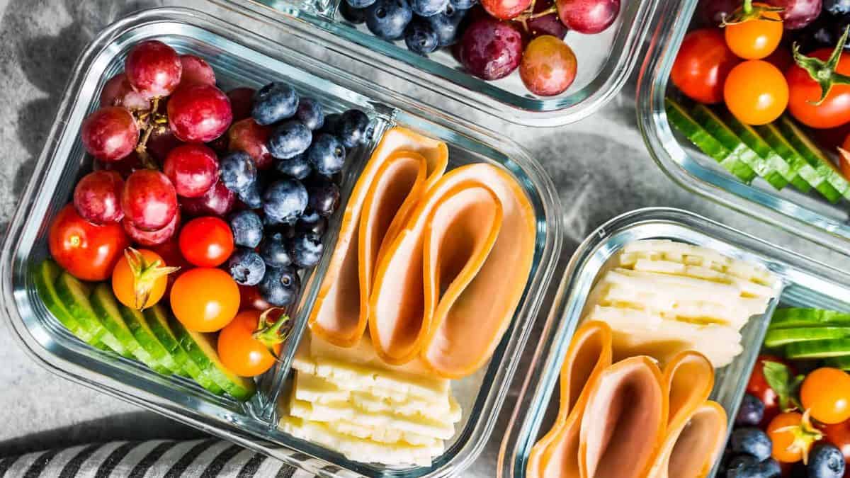 Different adult Lunchables in a lunch boxes.