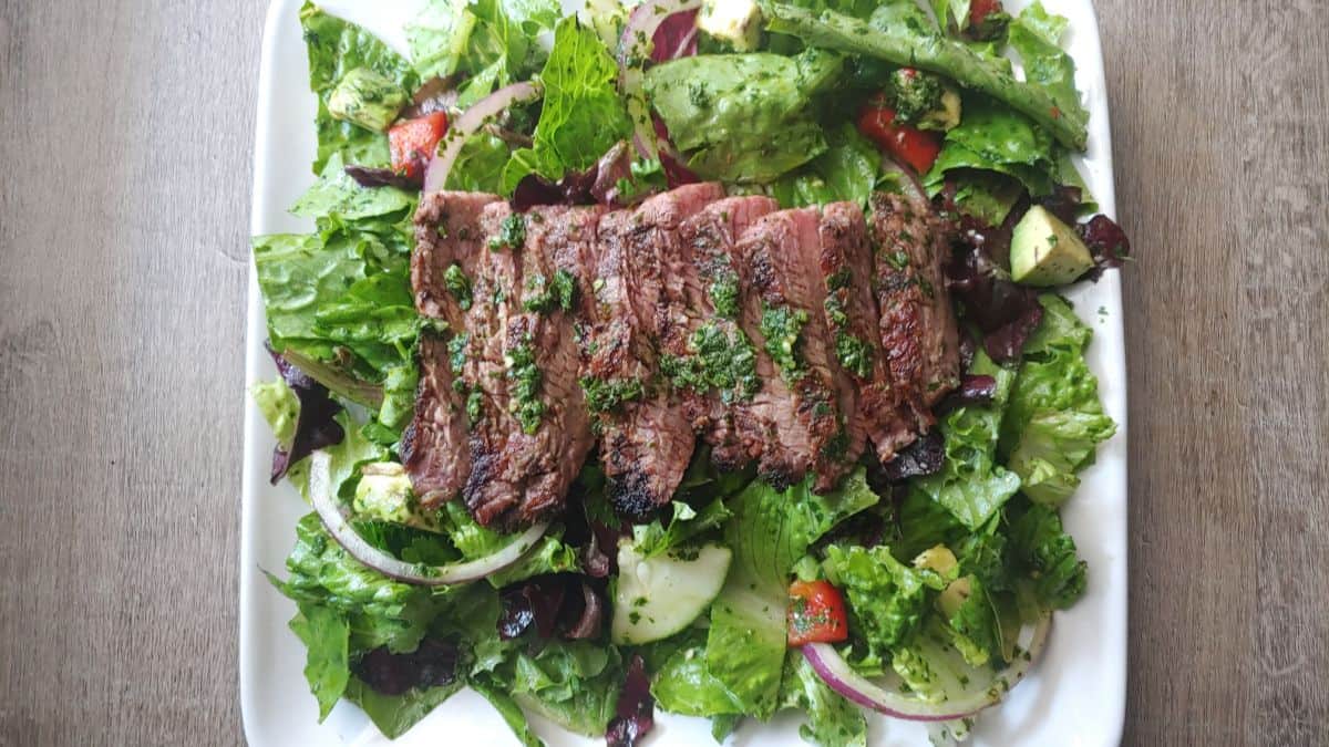 Beautifully plated chimichurri steak salad.