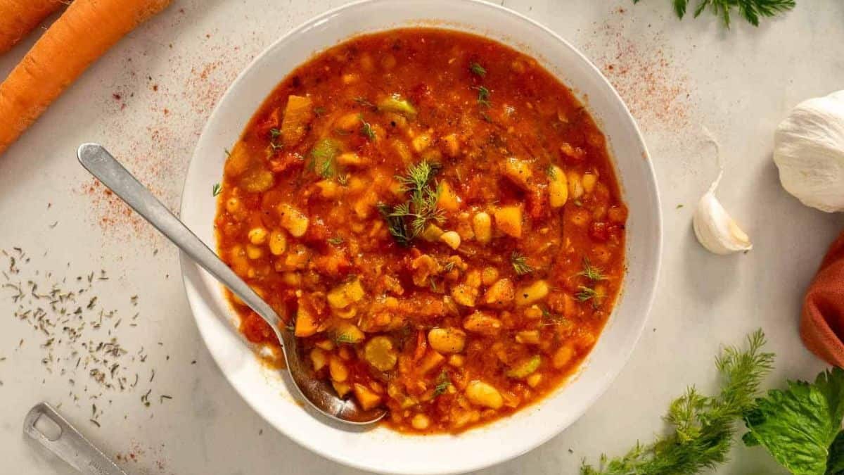 A serving of Fasolada Greek Bean Soup plated beautifully.