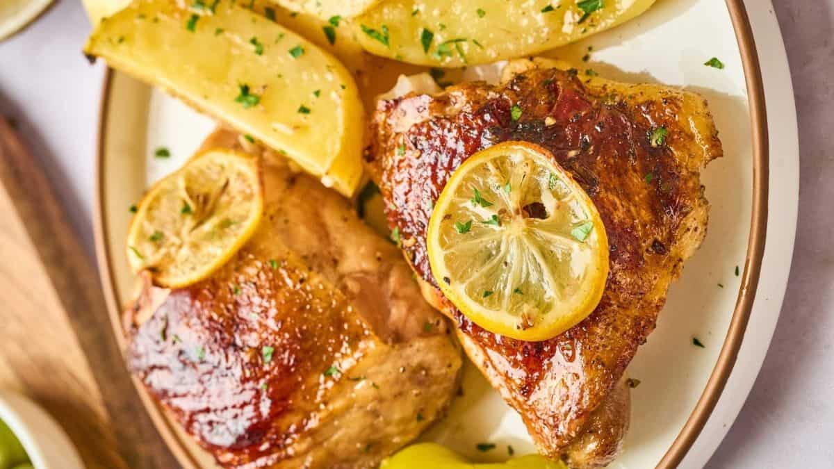 A serving of beautifully cooked Greek lemon chicken and potatoes.