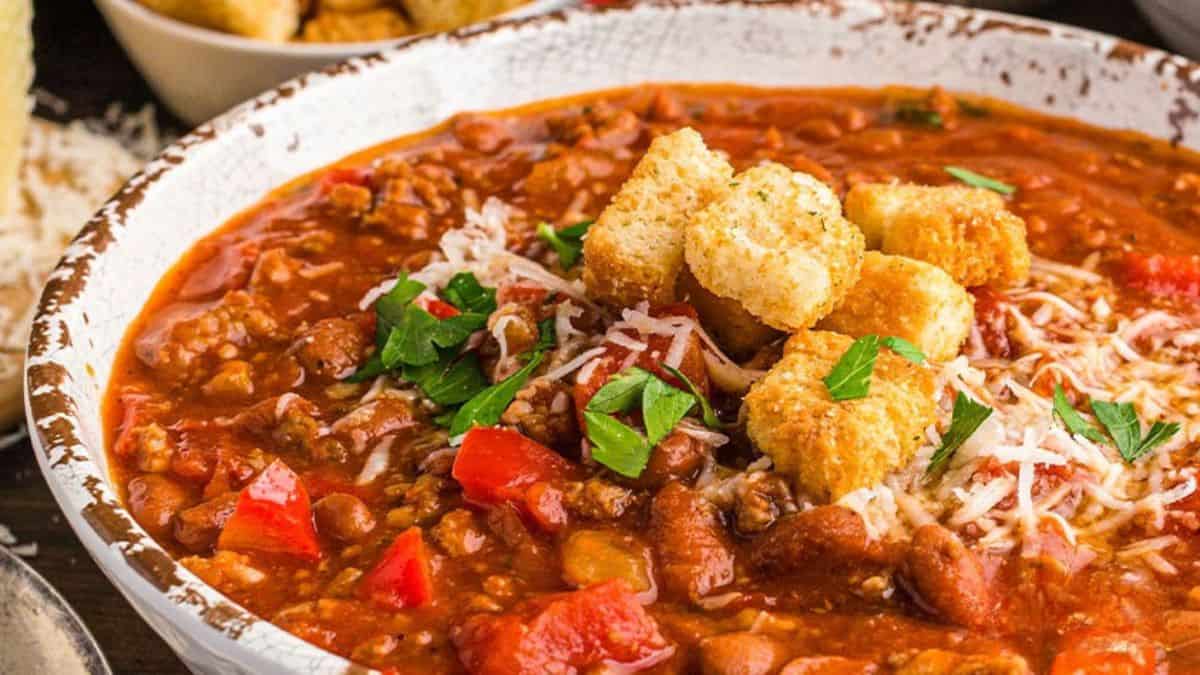 Beautifully plated Italian chili with sausage.