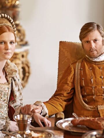 King and Queen at a table with food