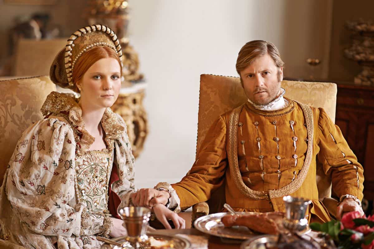 King and Queen at a table with food