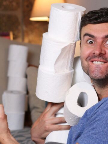 Man holding toilet paper