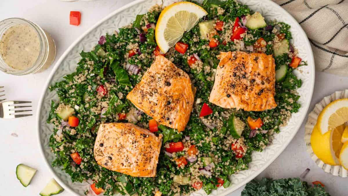 A colorful plate of salmon kale quinoa salad