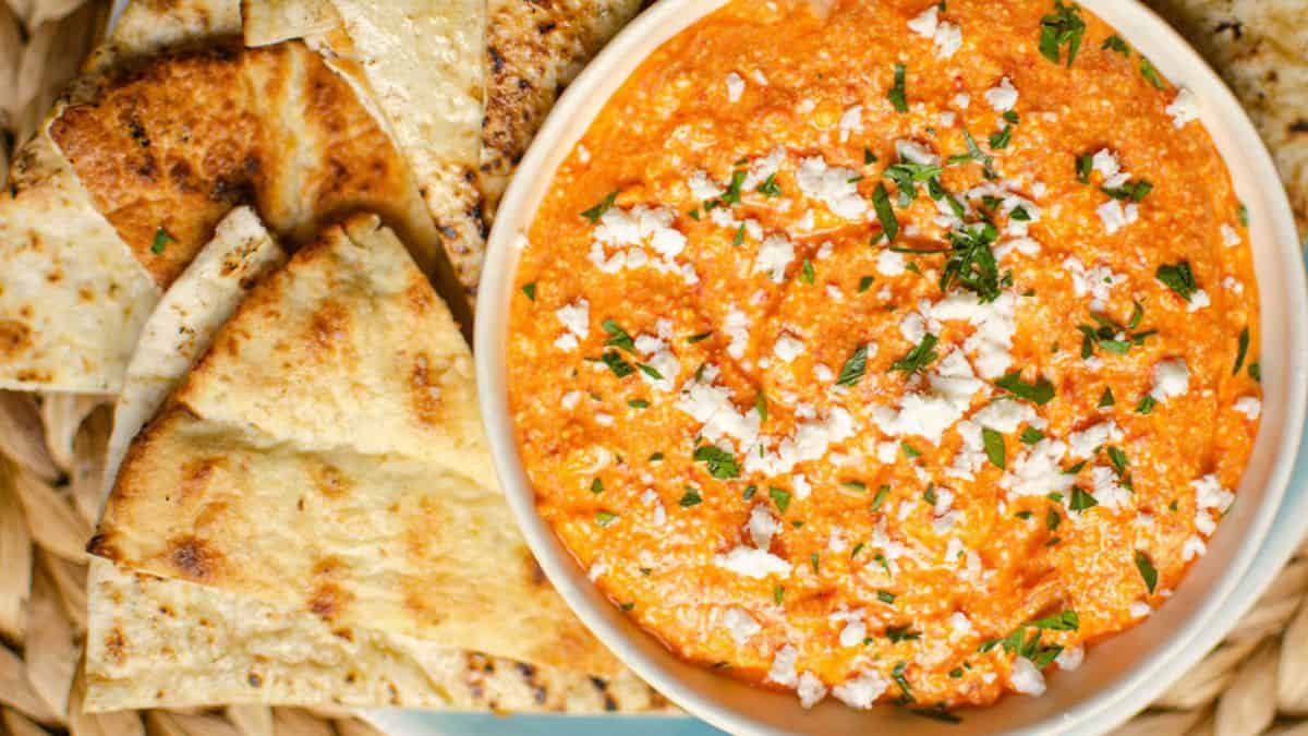 Tirokafteri or Greek spicy feta dip  with bread on the side.