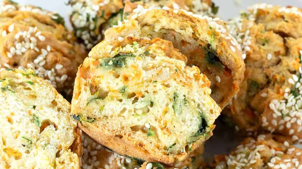 A batch of vegan savory muffins with spinach and carrots.