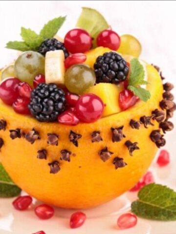 a fruit arrangement with grapes, cherries and berries