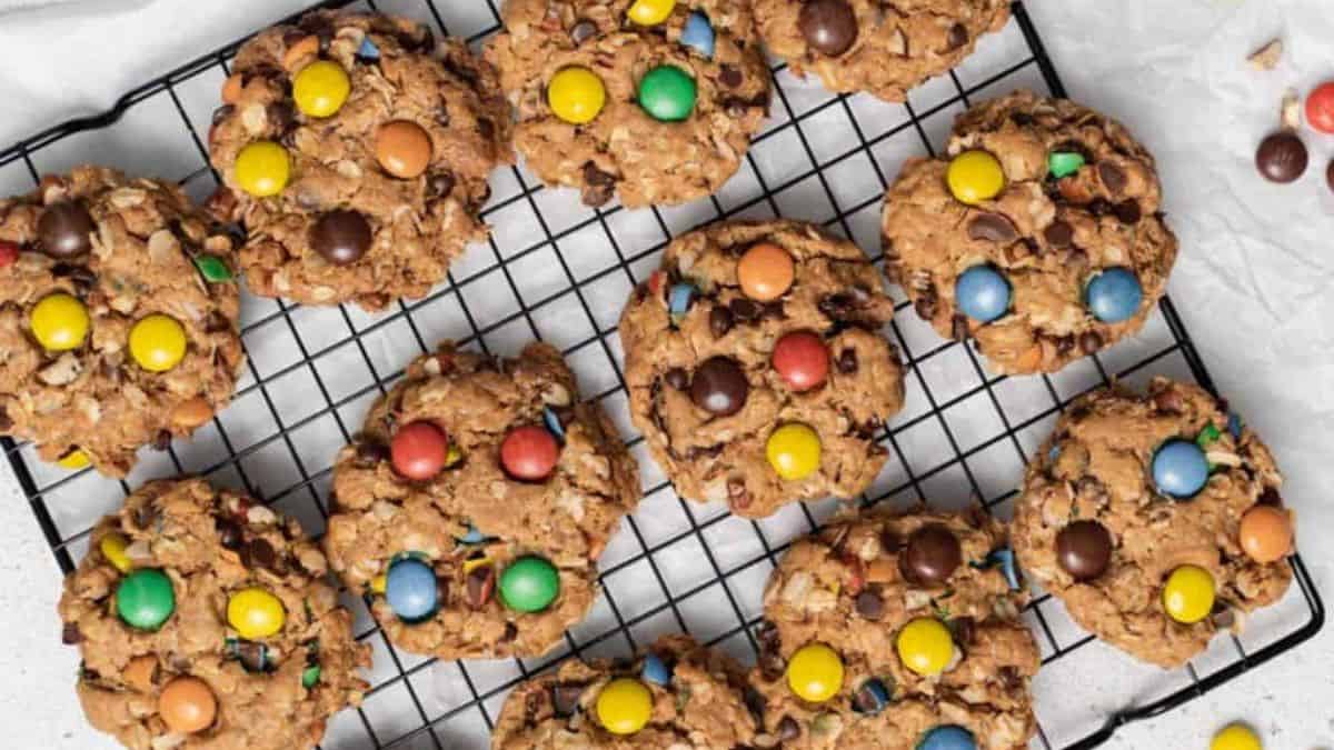 Gluten-free monster cookies in a cooling rack.