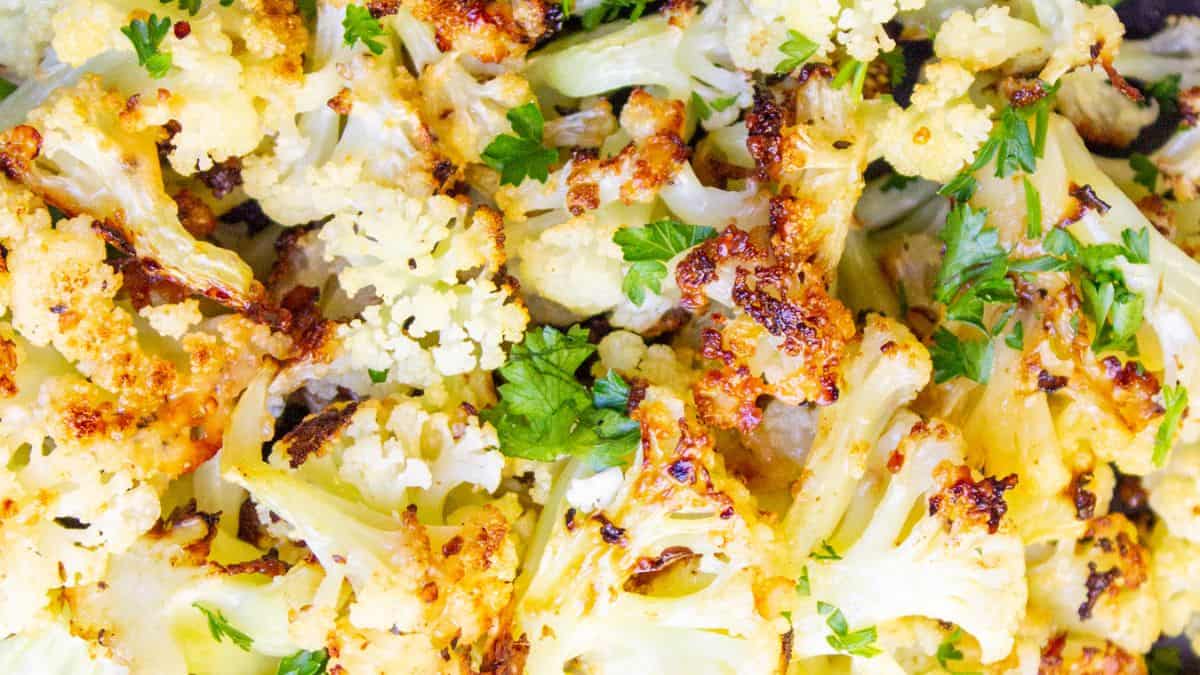 Freshly baked cauliflower with cheese and brown crispy edges.