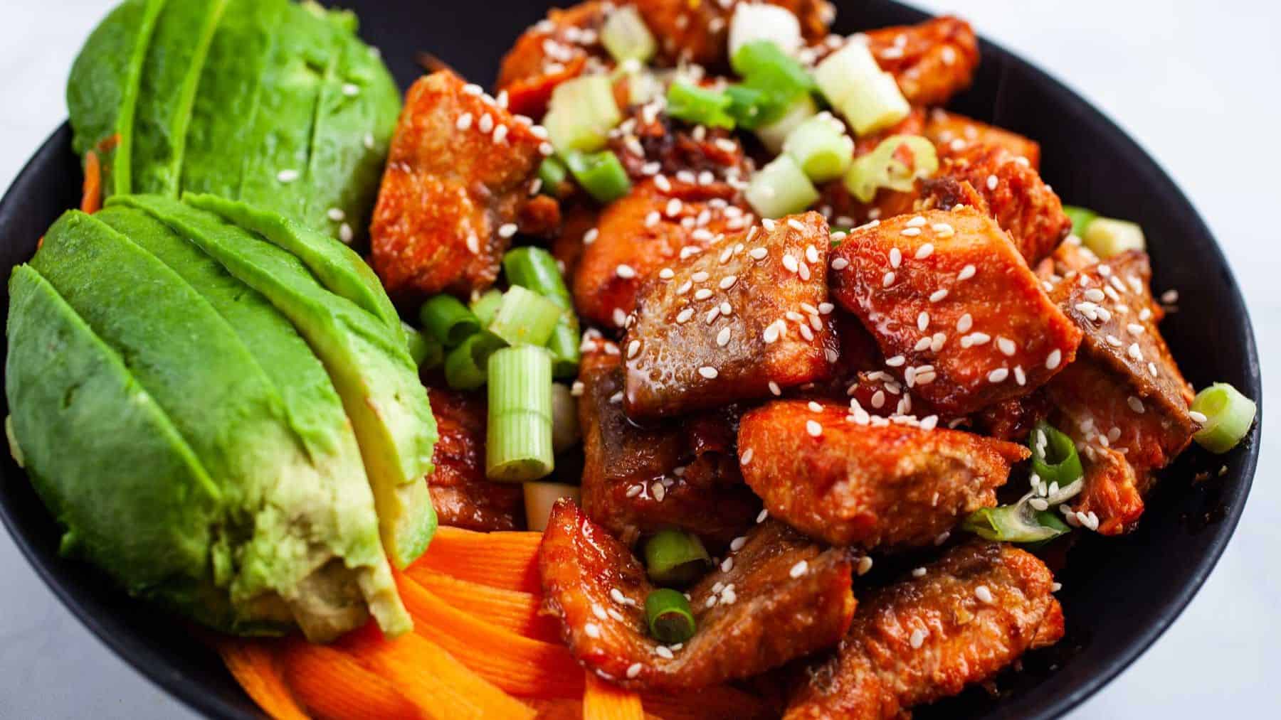 Gorgeously plated cooked salmon poke bowl with easy sauce.