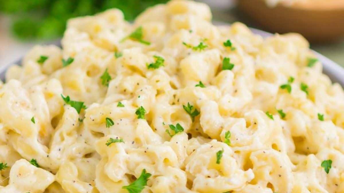 Creamy garlic parmesan mac and cheese topped with parsley.