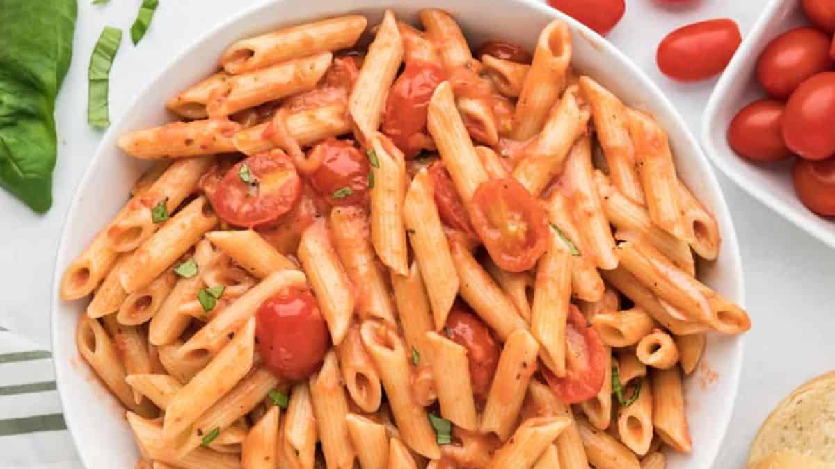 A bowl of freshly cooked creamy tomato pasta sauce with coconut milk.