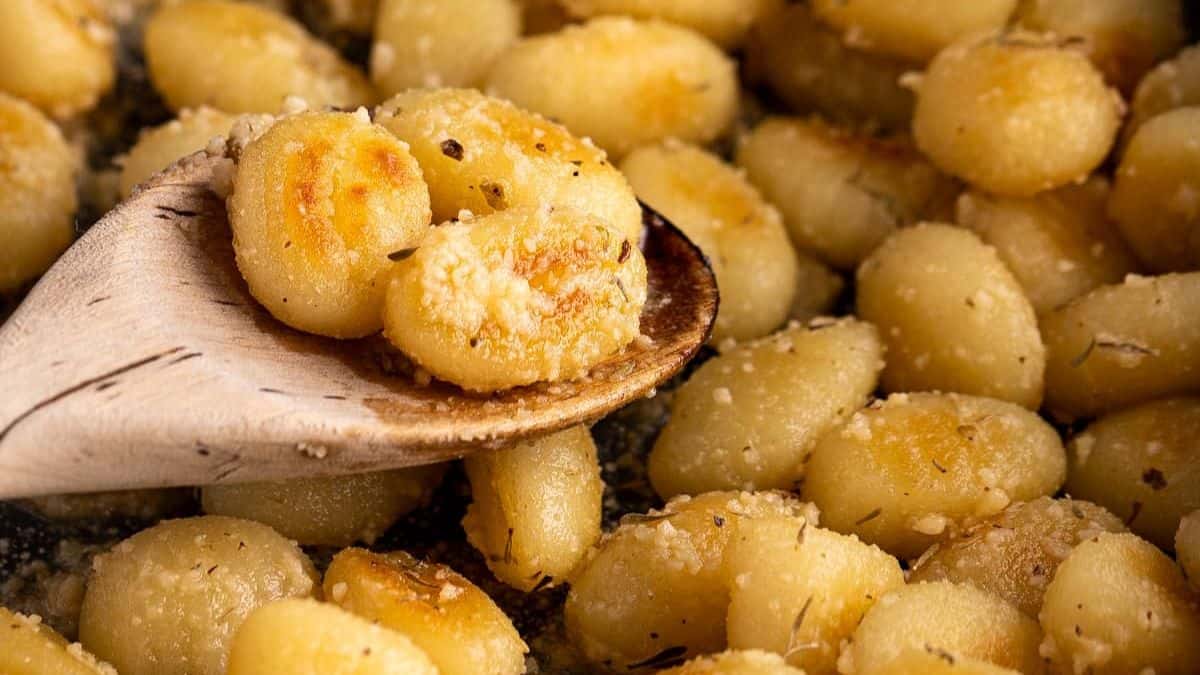 Crispy pan-fried gnocchi in a pan.
