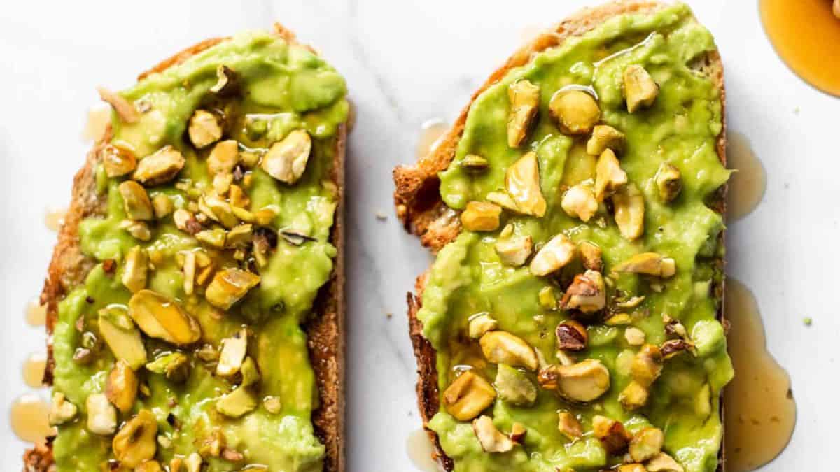 Sumptuous avocado toast with honey and pistachios.