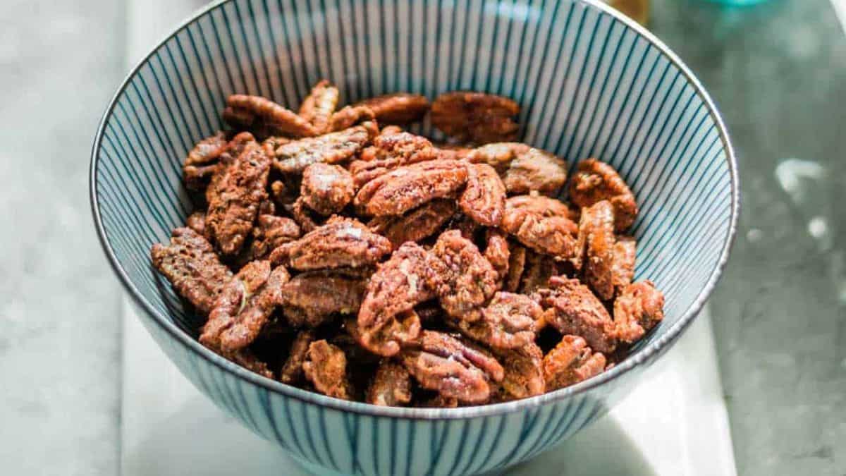 A bowl of sweet and spicy pecans with chipotle or easy candied nuts.