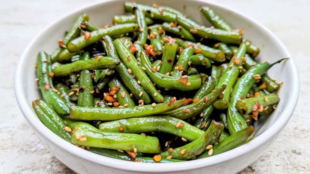 A bowl of garlic sesame green beans.