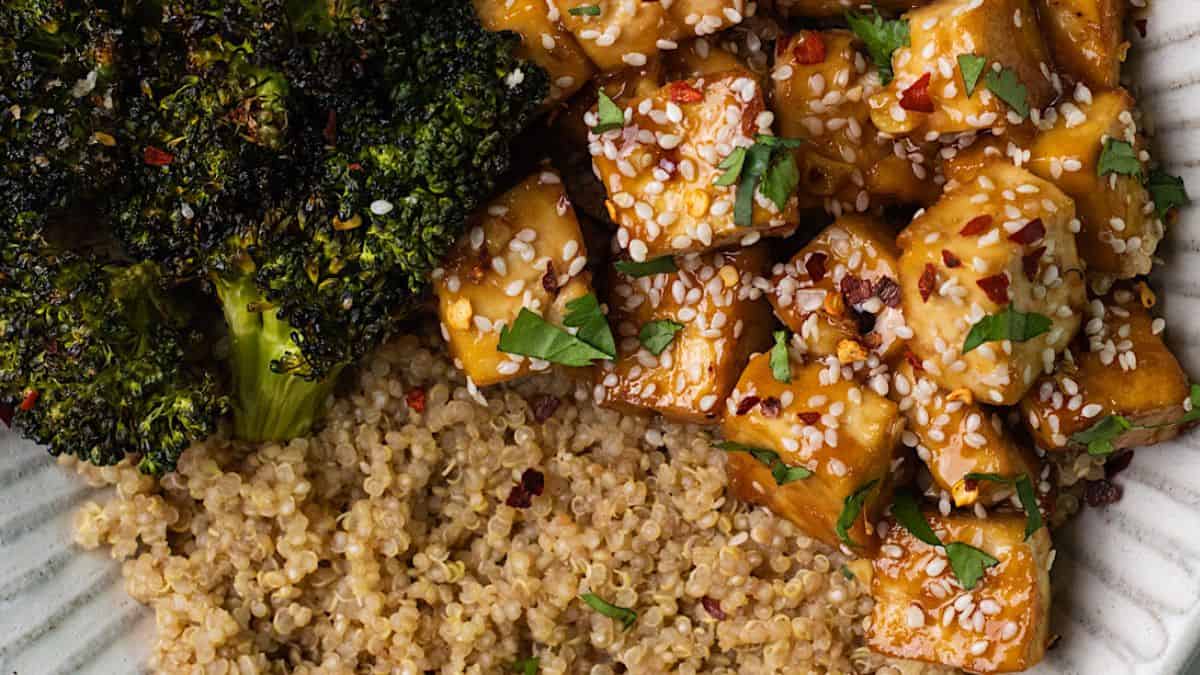 Ginger honey tofu bowls with broccoli plated in a white plate.