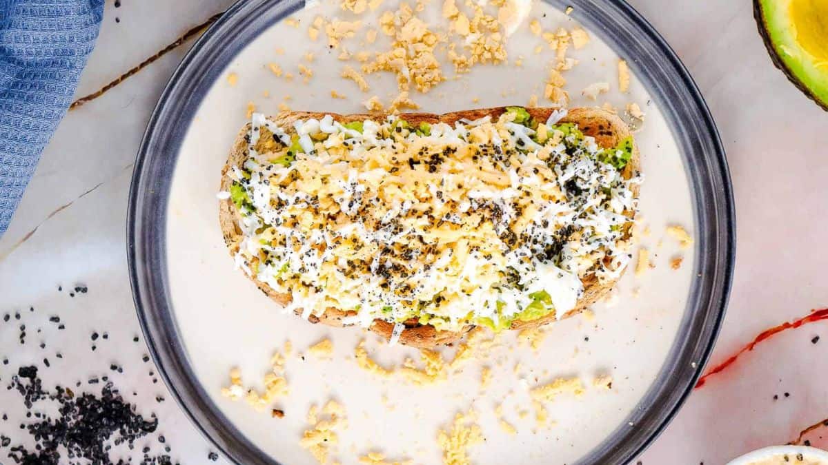 Grated egg avocado toast beautifully plated.