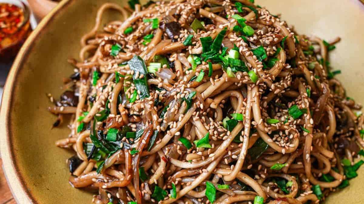 Vietnamese stir fry noodles or ni xao xi dau in a wooden plate.