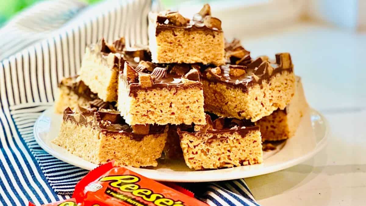 Reese's peanut butter cup rice Krispie treats sliced in squares.