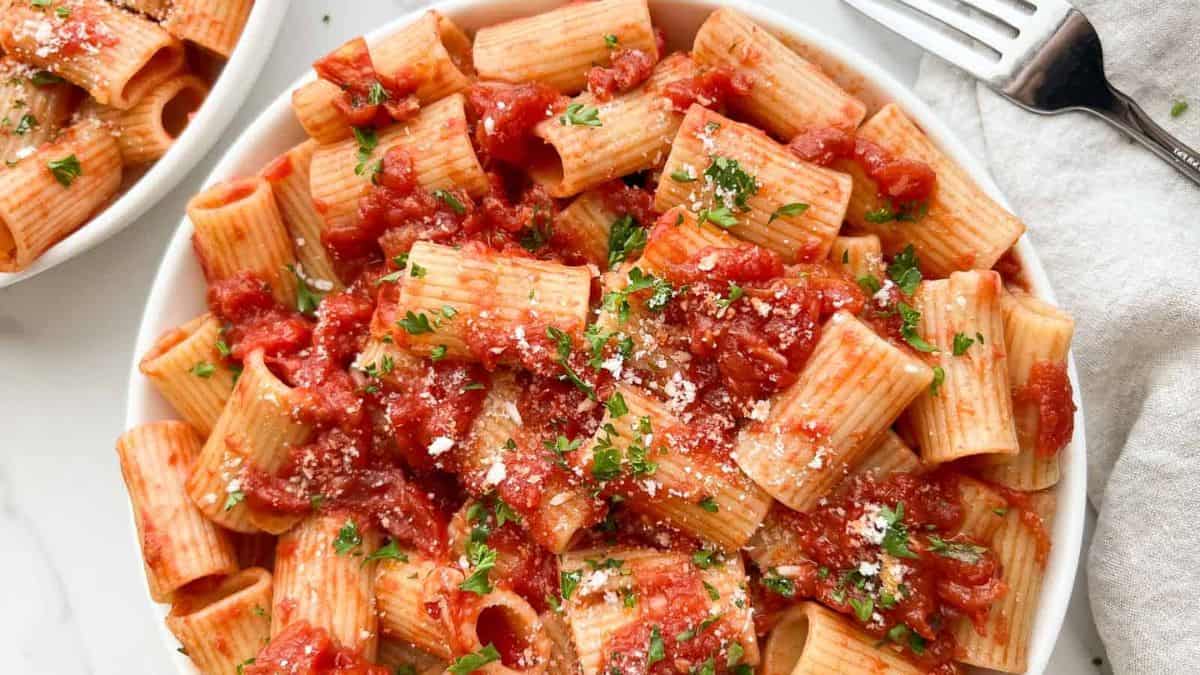 A beautifully plated bowl of rigatoni arrabbiata