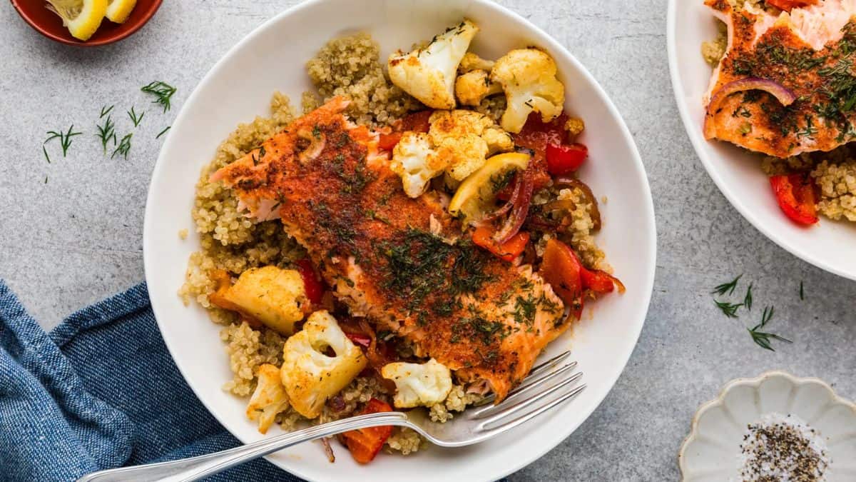 A plate of salmon quinoa bowl recipe.