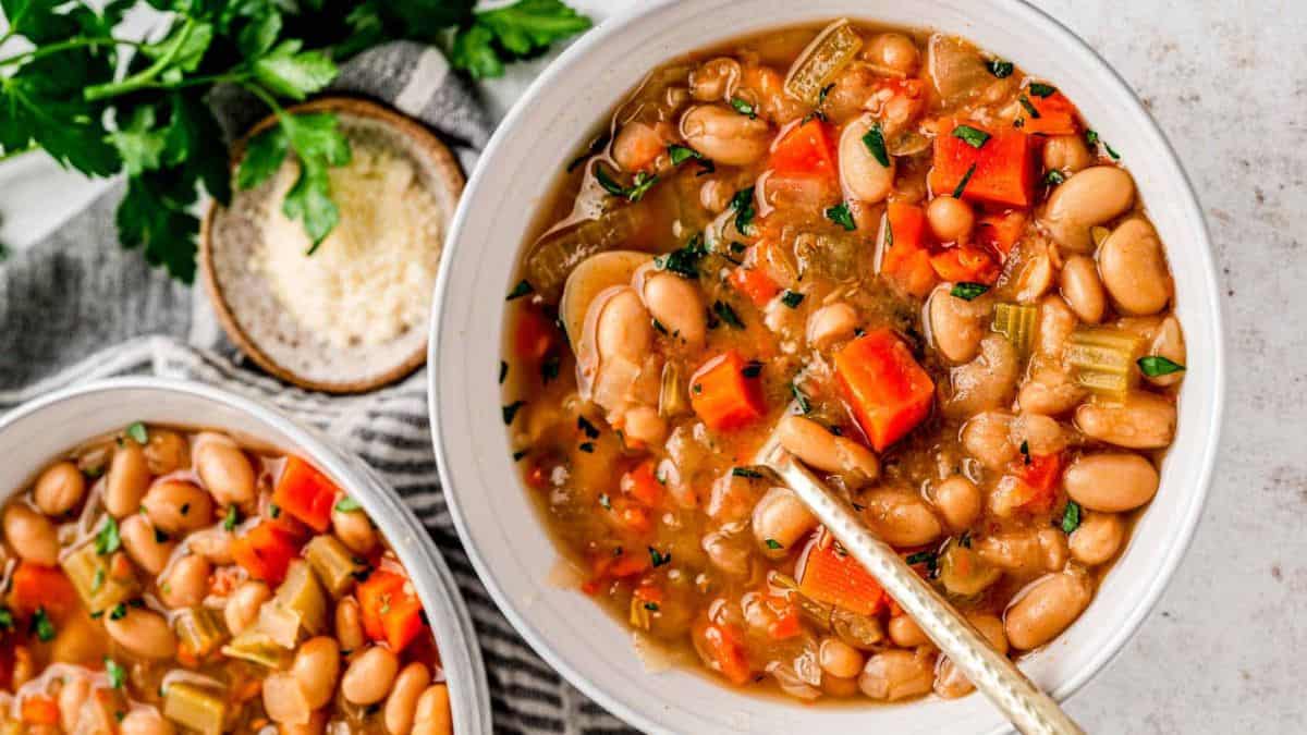 A bowl of slow cooker white been soup recipe.