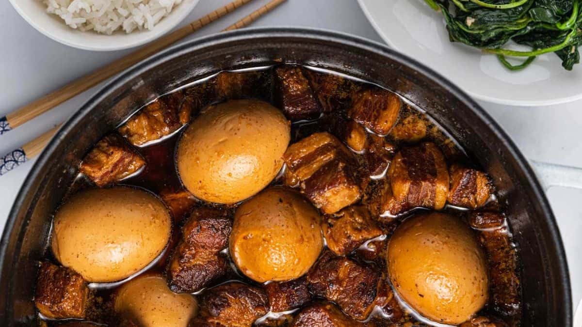 Thit kho or Vietnamese braised pork and egg in a black bowl.