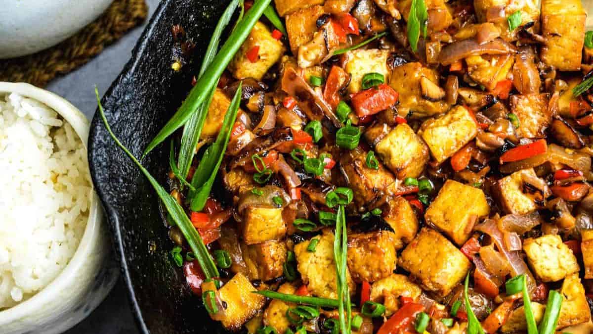 Tofu sisig in a skillet.