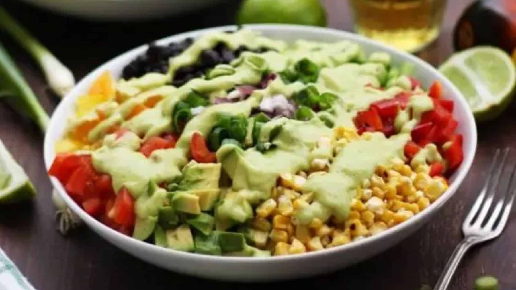 A plate of freshly made vegan Mexican chopped salad with avocado dressing