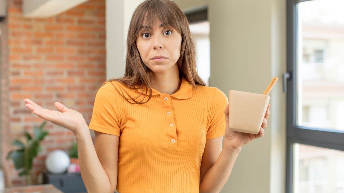 confused woman with takeout