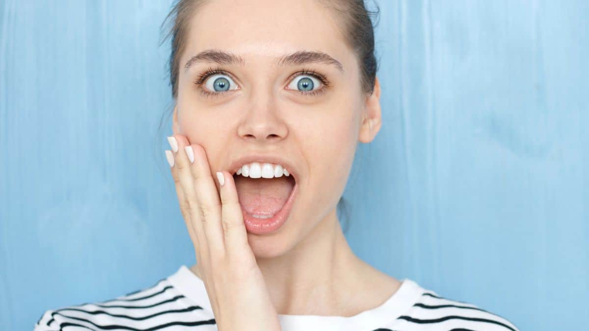 happy woman looking surprised