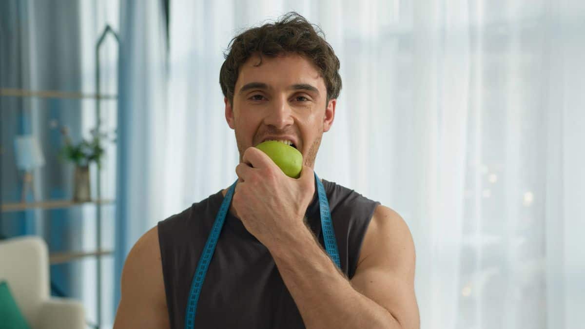 man eating apple