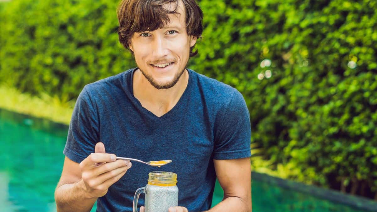 man eating chia pudding