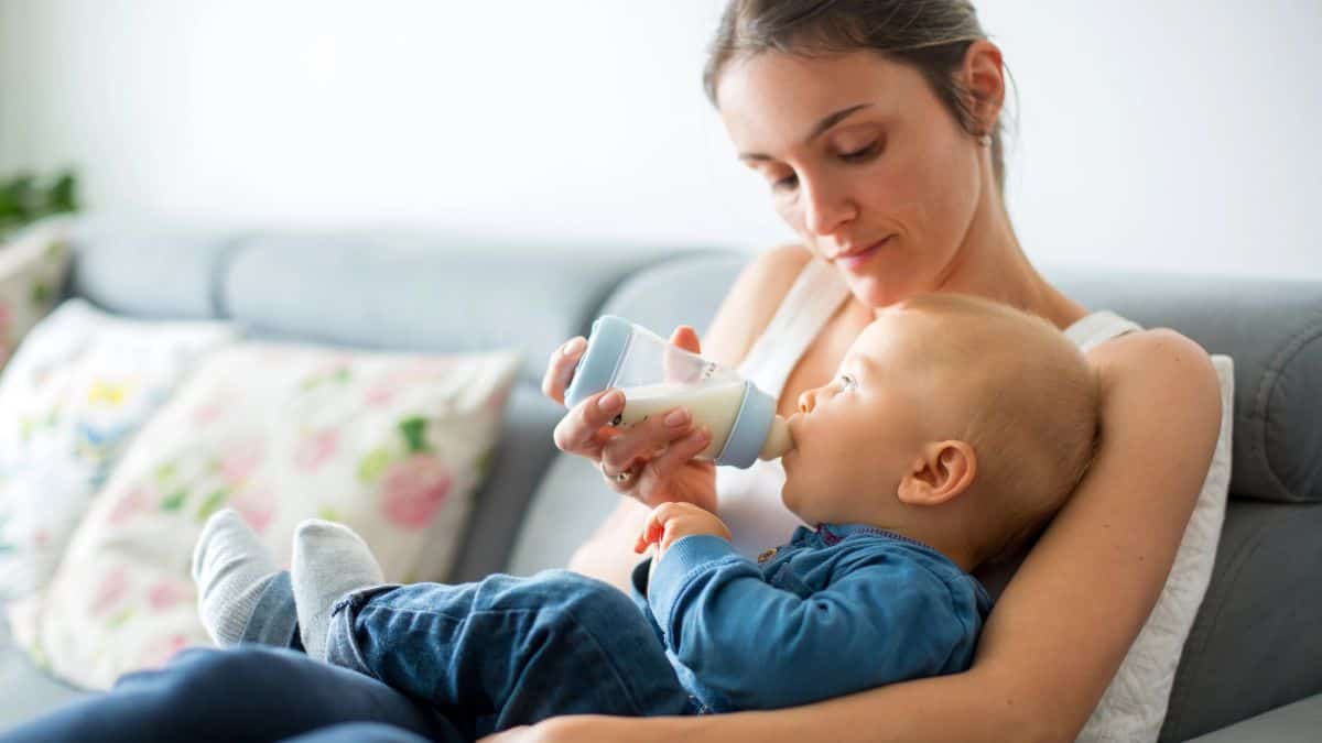 mom bottle feeding baby