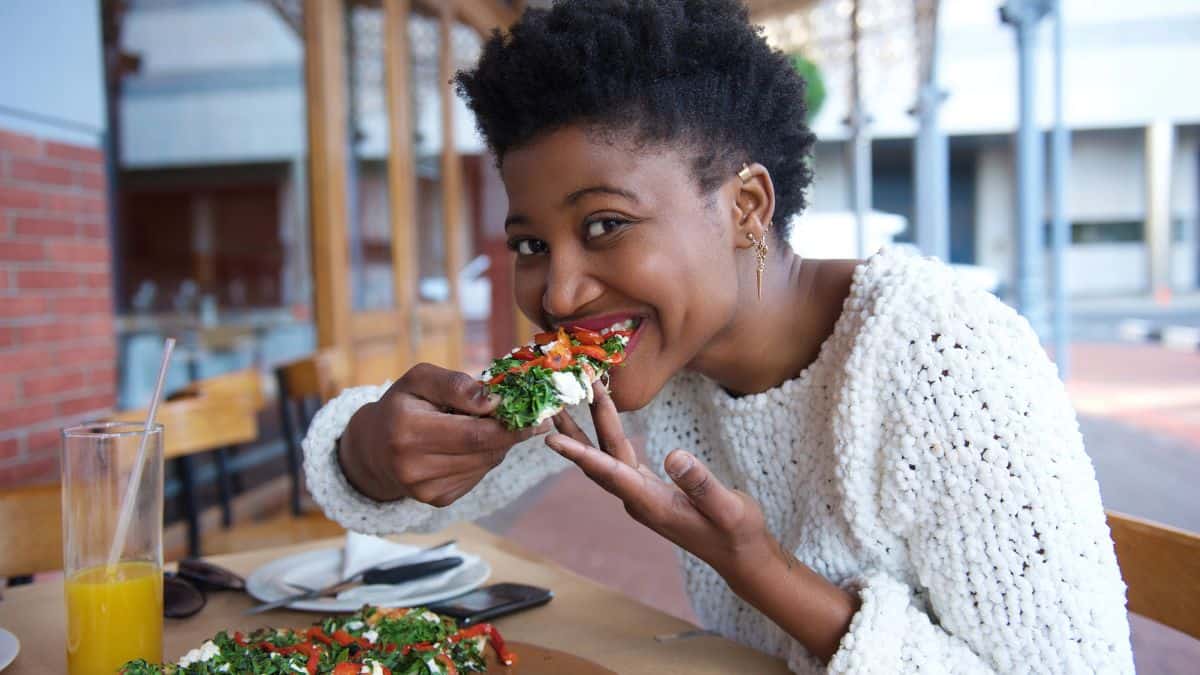 woman eating pizza