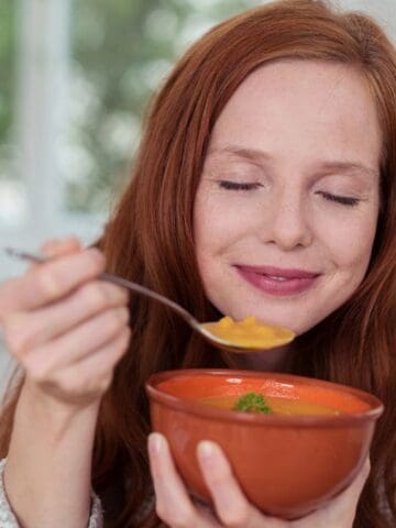 woman eating soup