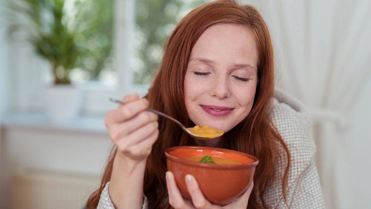 woman eating soup