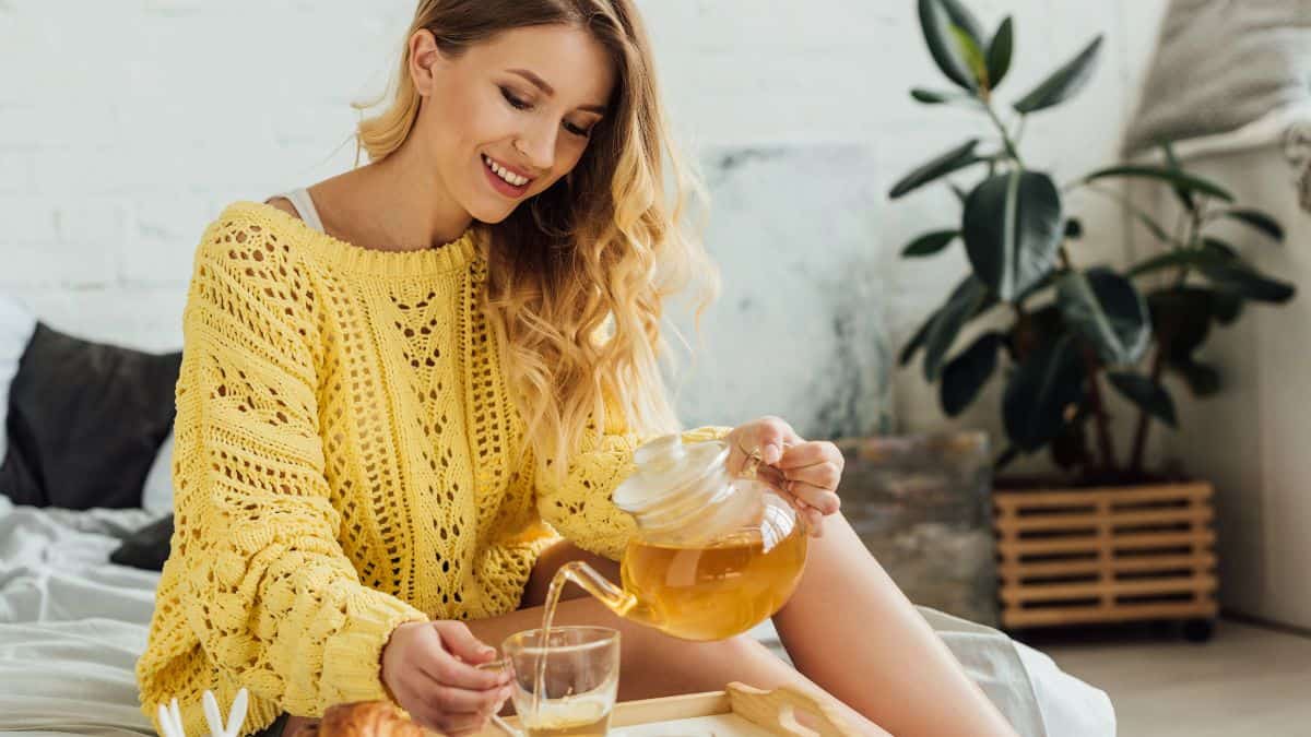 woman pouring tea