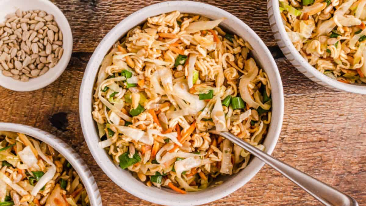 Three bowls of Asian ramen coleslaw.