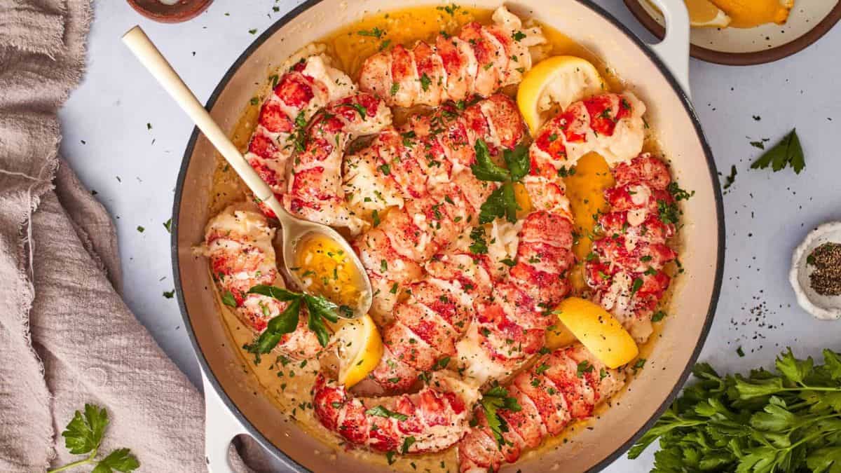 Butter-poached lobster tail in a pan