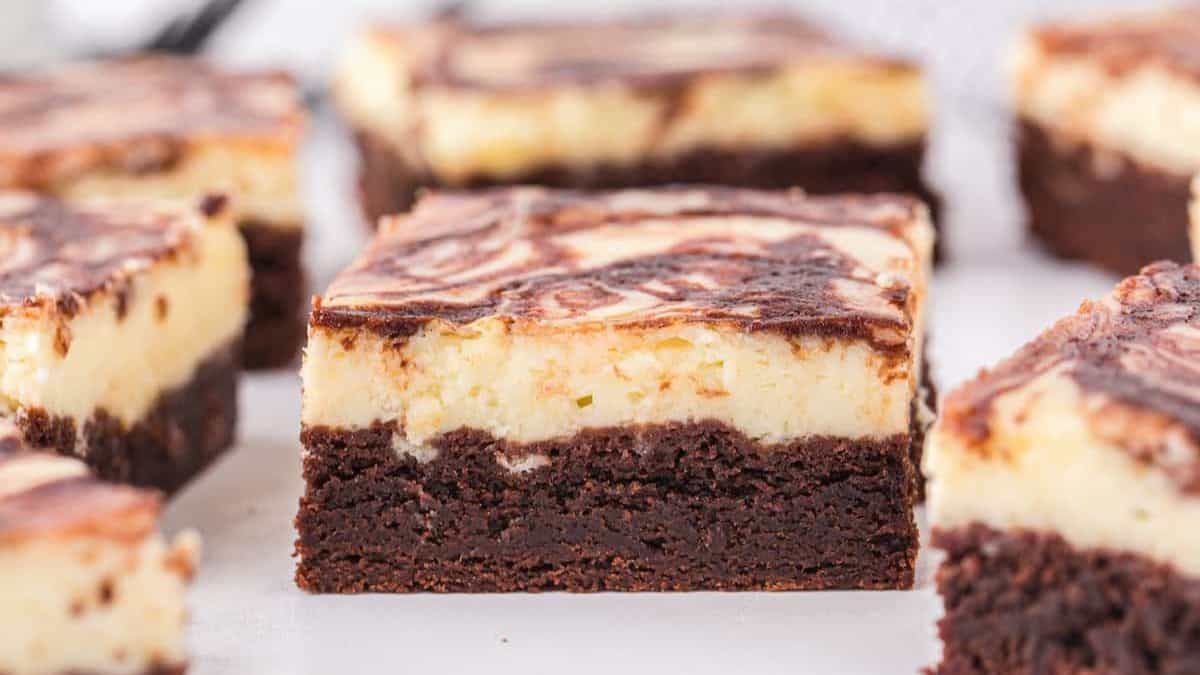 Perfectly cut in squares cheesecake brownies.