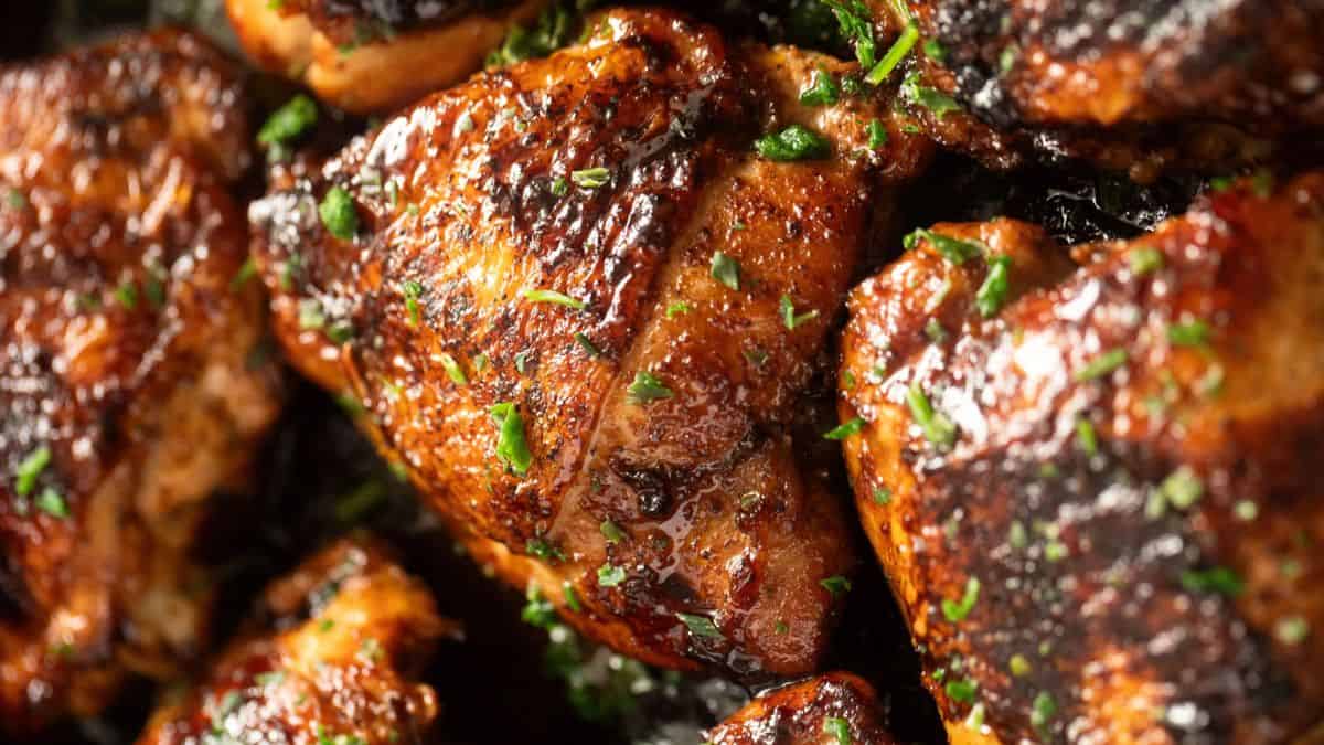 Freshly cooked chicken with Guinness garnished with fresh herbs.