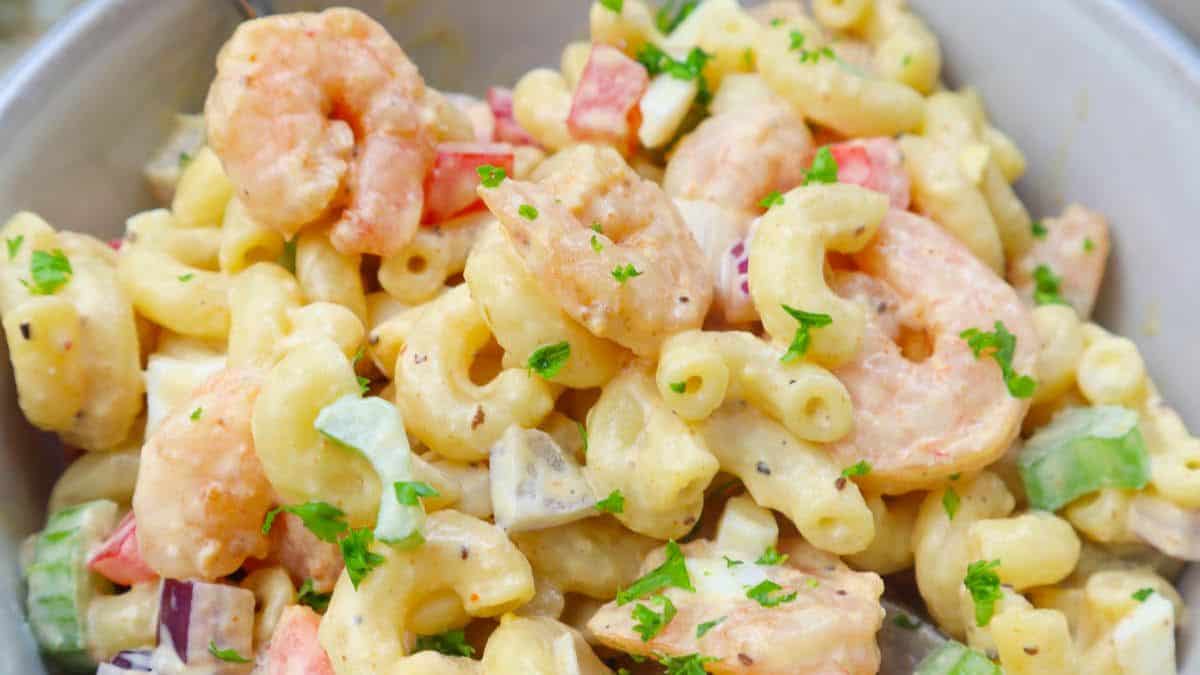 A bowl of creamy macaroni shrimp salad with old bay.