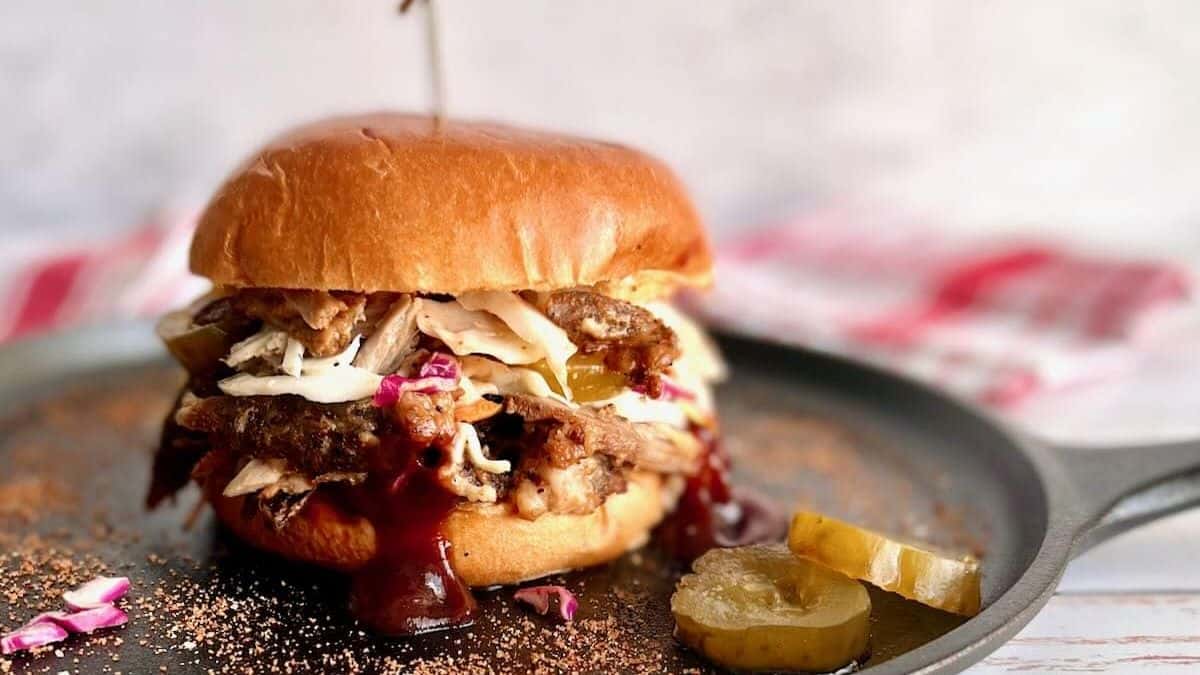 Mini Dutch oven pulled pork burger with barbecue sauce.