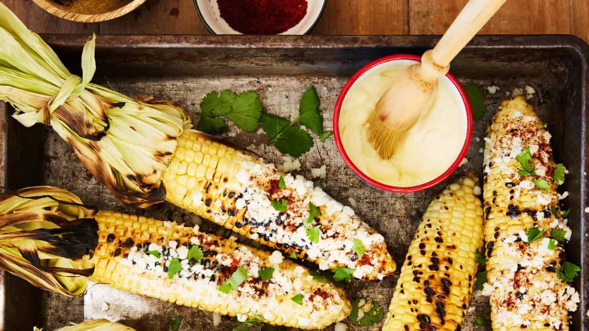 Freshly smoked street corn with chopped fresh cilantro on top.