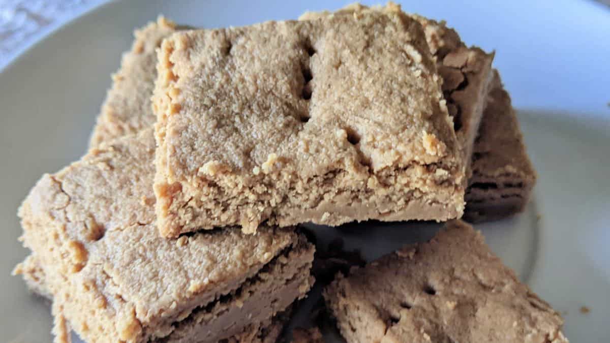 Peanut shortbread cookies cut in squares.