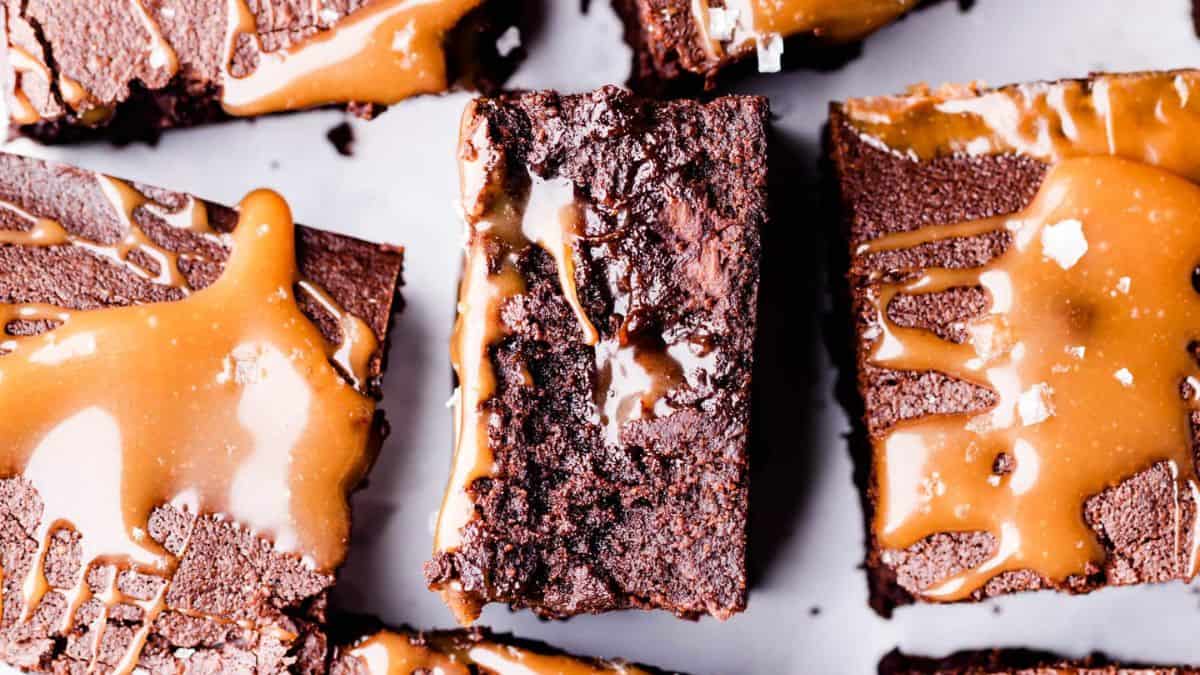 Guinness brownies sliced in squares drizzled with caramel sauce.