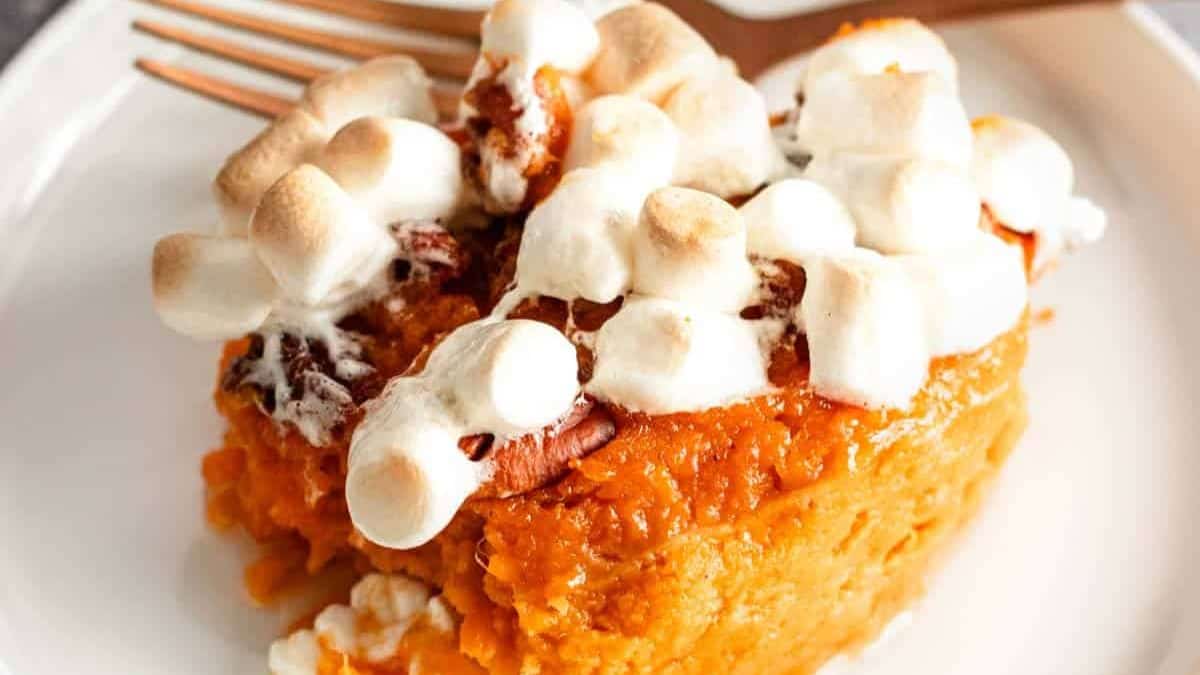 A serving of sweet potato casserole with marshmallows.